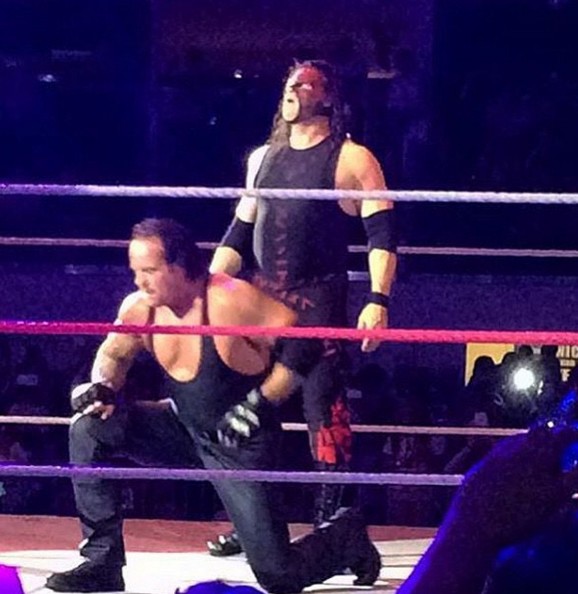 Undertaker and Kane do their signature pose