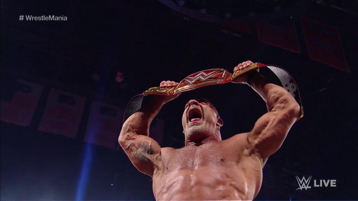 Goldberg poses with the WWE Universal Title on the Raw before WrestleMania 33