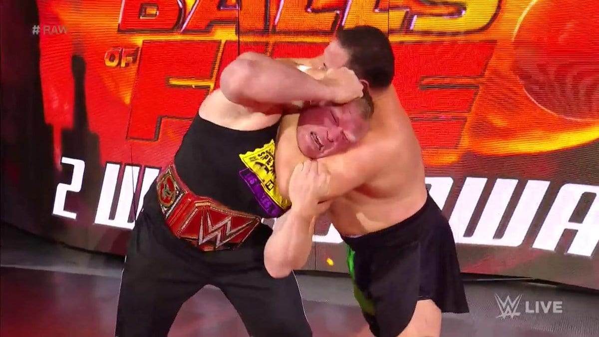 Samoa Joe applies the Coquina Clutch On Brock Lesnar