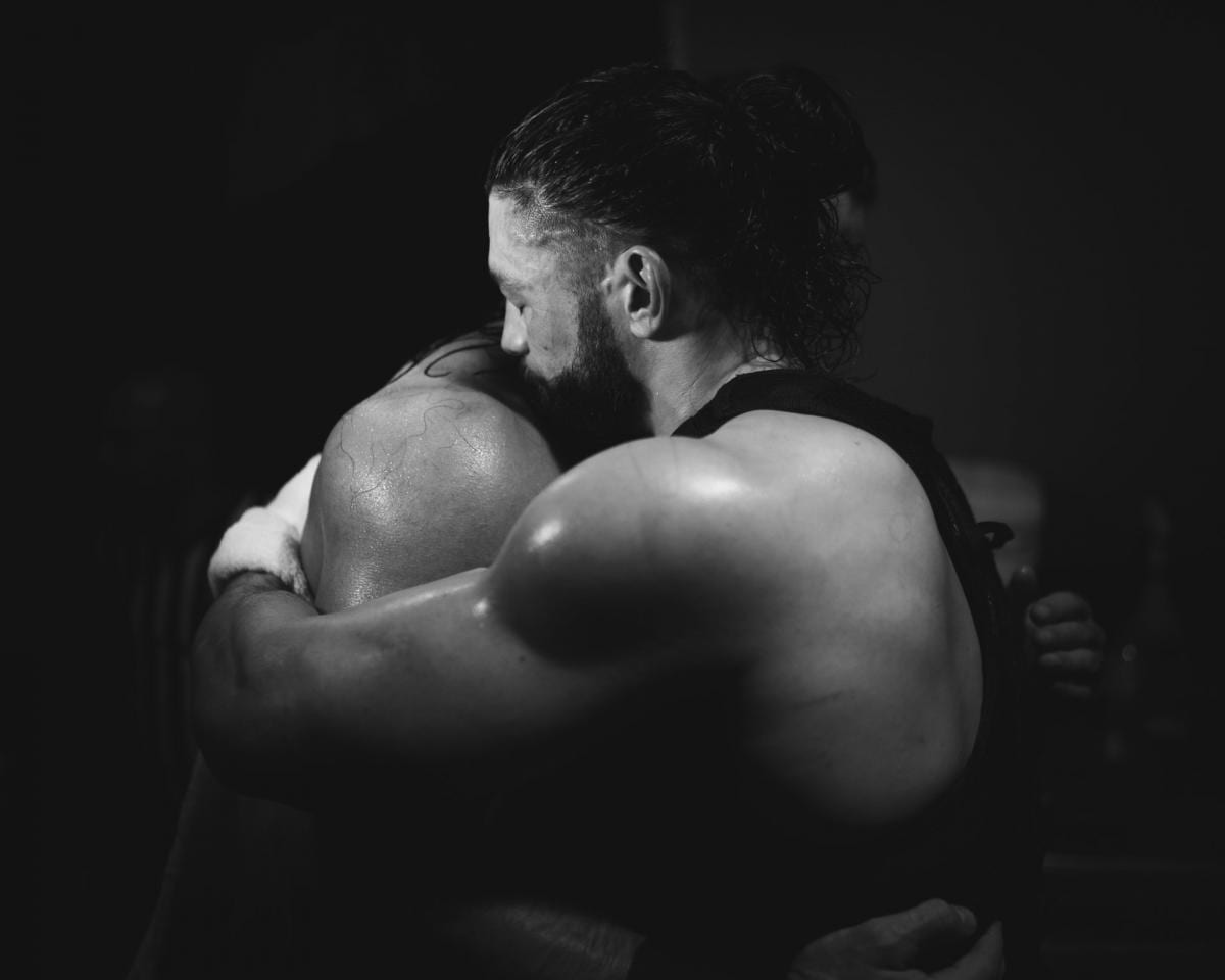 Roman Reigns hugs Drew McIntyre backstage WWE Royal Rumble 2020 emotional moment