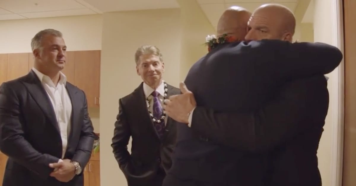 Shane McMahon Vince McMahon Triple H The Rock Hug At Rocky Johnson's Funeral