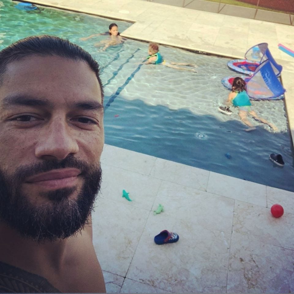 Roman Reigns spending time with his kids at the pool