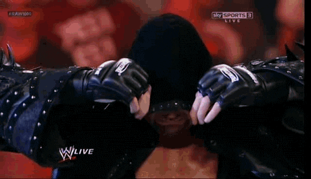 Undertaker Coat Jacket Stuck On His Head At WWE RAW 1000