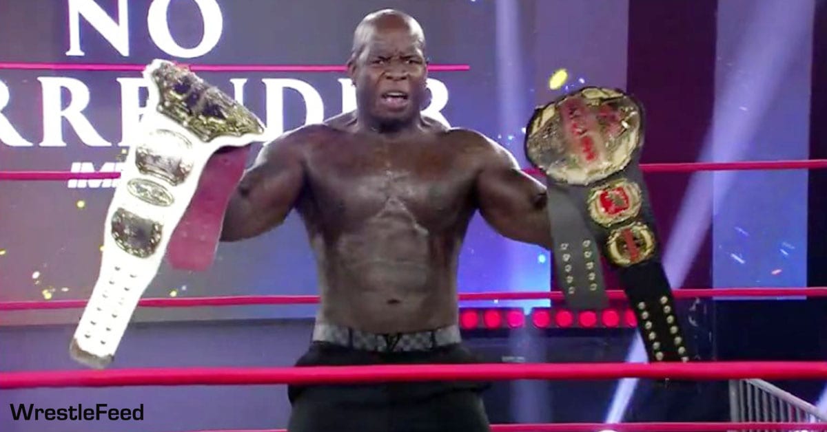 Moose posing with the Impact World Championship and TNA World Heavyweight Championship No Surrender 2021 WrestleFeed App