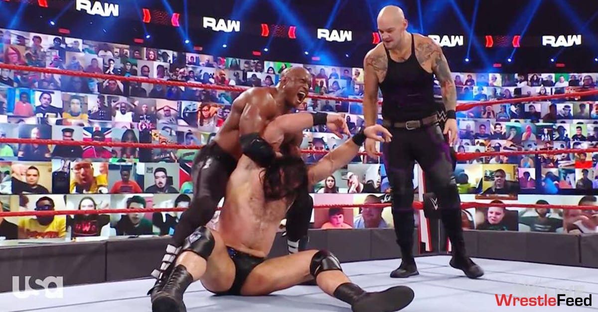 Bobby Lashley applies Hurt Lock on Drew McIntyre as King Baron Corbin looks on WWE RAW March 2021 WrestleFeed App