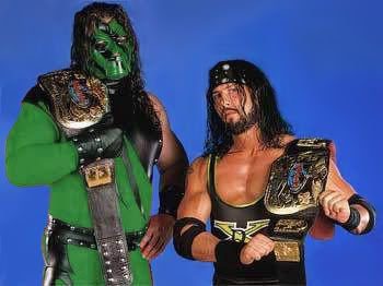 Kane in a green ring outfit and mask with X-Pac WWF Tag Team Champions