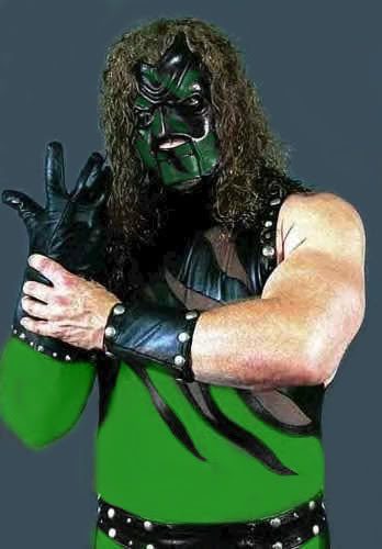 Kane in a green ring outfit and mask