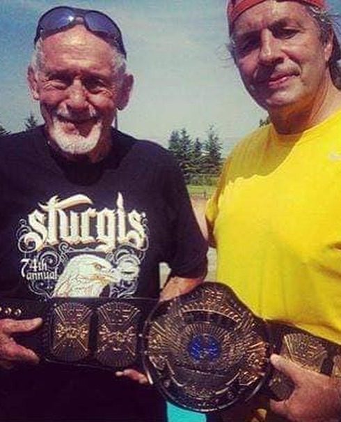 Reggie Parks posing with Bret Hart and his designed WWF Championship winged eagle belt