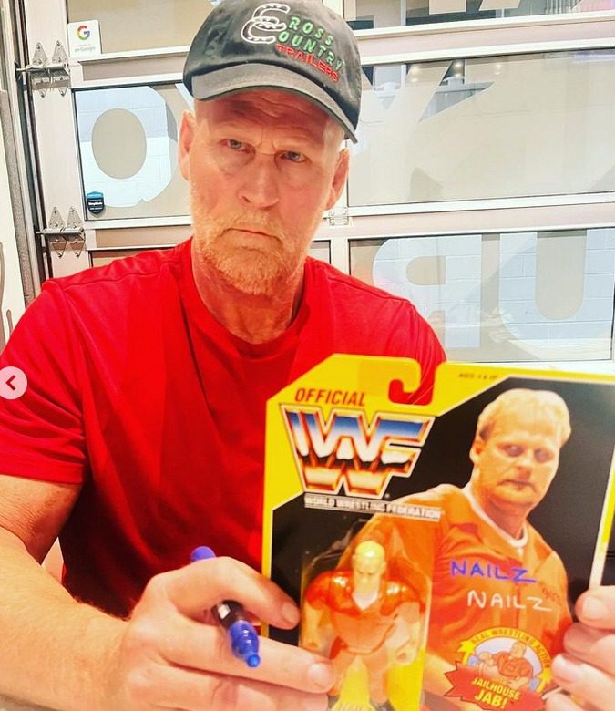 WWF Veteran Nailz Signs Autograph On His Action Figure June 2023