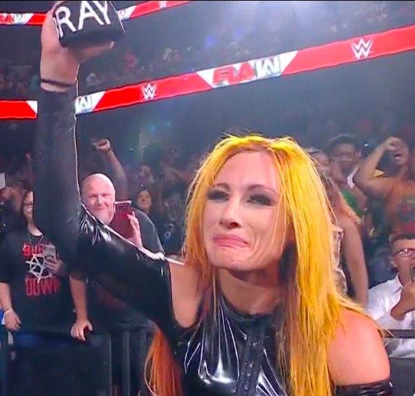 Becky Lynch raises Bray Wyatt wrist band emotional tribute WWE RAW August 28 2023