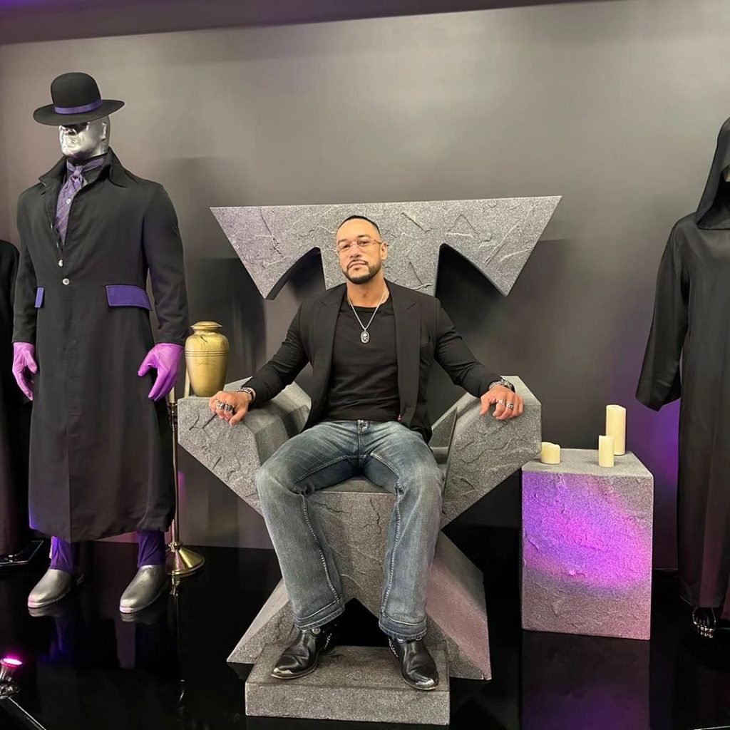 Damian Priest Sitting On Undertaker Throne