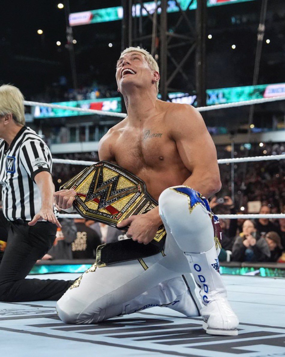 Cody Rhodes looking up at his late father Dusty Rhodes after winning the WWE Championship at WrestleMania 40