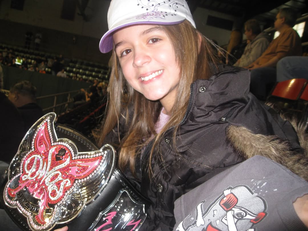 Cora Jade Elayna Black with WWE Divas Championship as a kid child